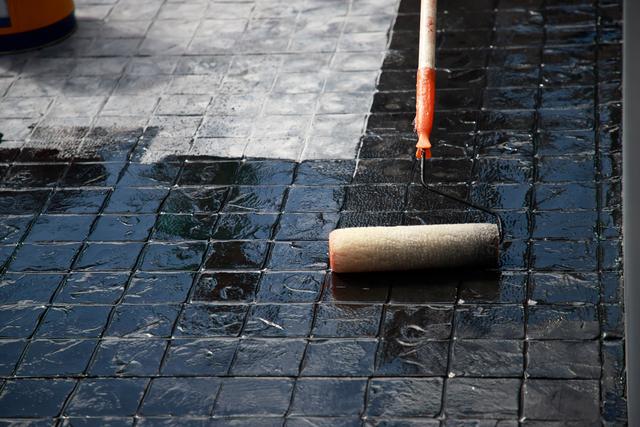 Waterproofing expert working on a roof